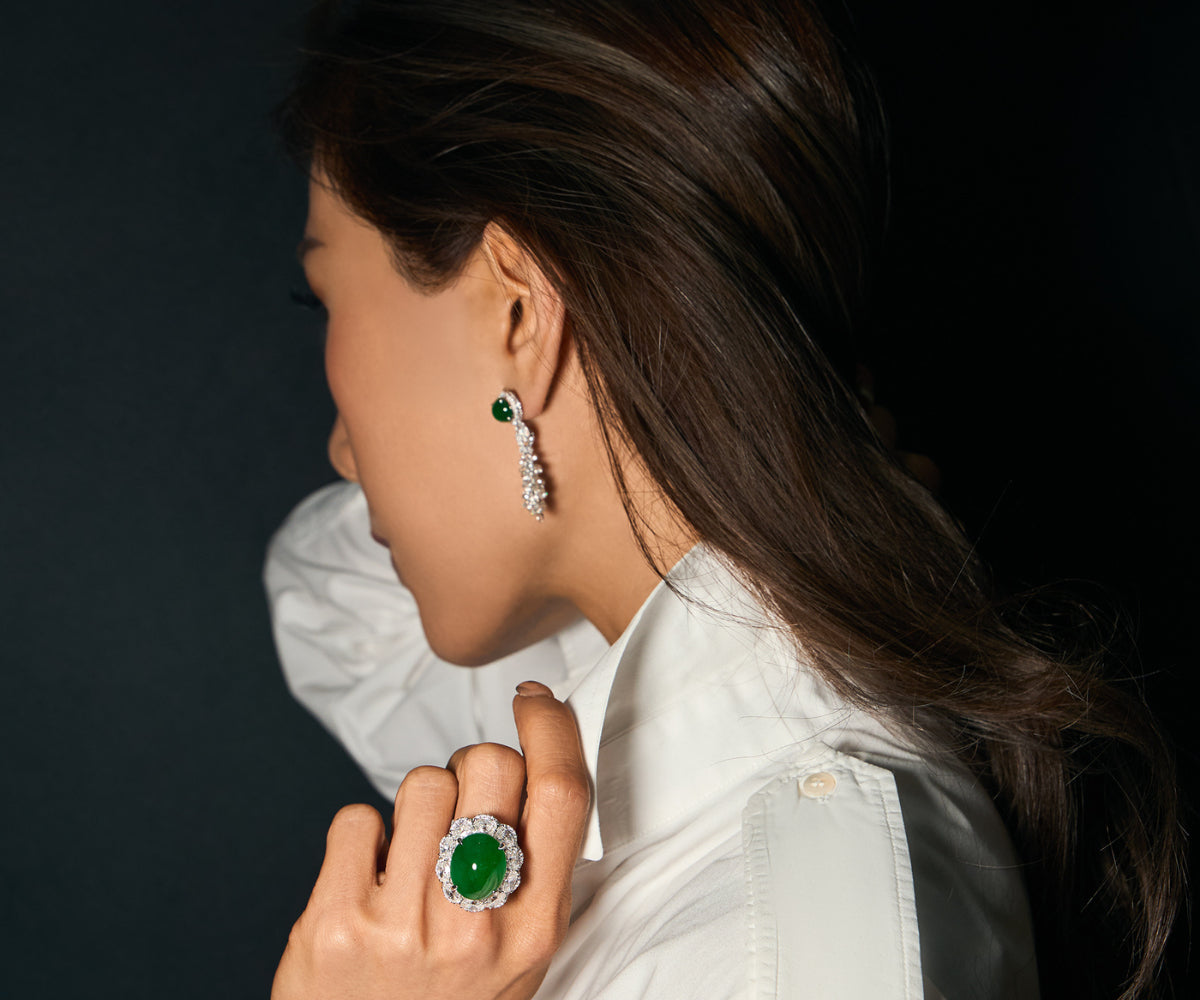 Editorial side profile of model wearing The Oval Cabochon Ring and The East-West Oval Cabochon Drop Earrings, photographed against a clean backdrop, styled with a white shirt demonstrating the pieces' architectural restraint and suitability for daily wear.
