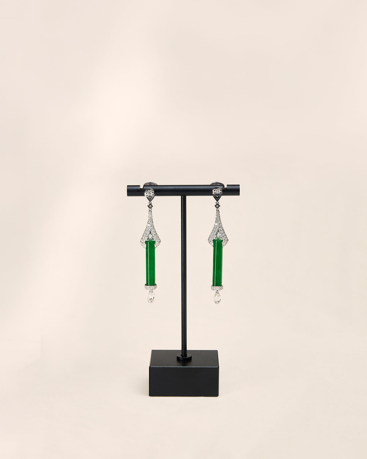 Rear view of The Cylinder Drop Earrings showing the reverse side of the pavé diamond fan setting, the smooth back of the intense green cylindrical jadeite, and the 18K white gold earring findings.