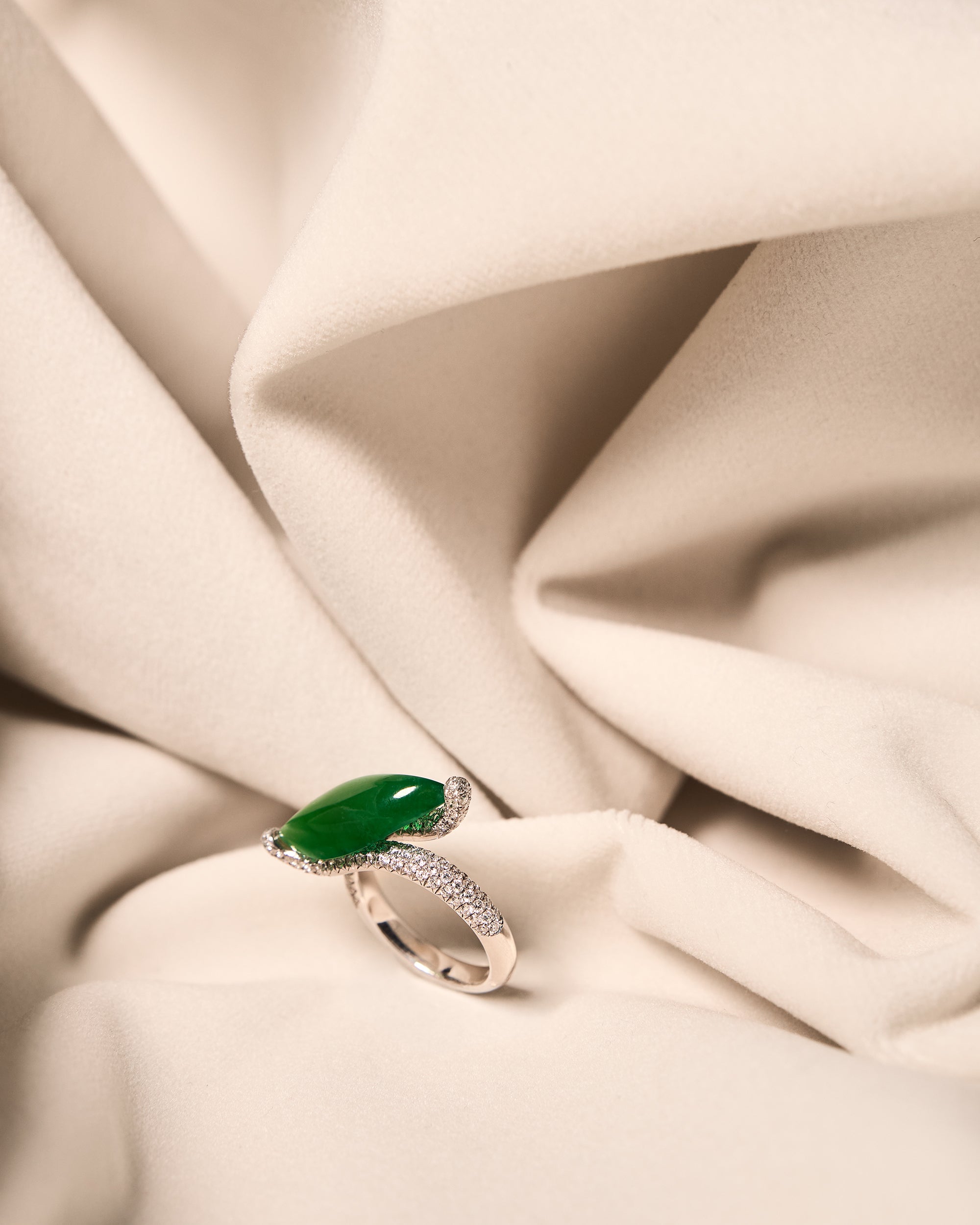 Lateral profile of The East-West Marquise Ring on ivory cloth, highlighting the 7.9 mm setting height and the elegant curve of the bypass band.