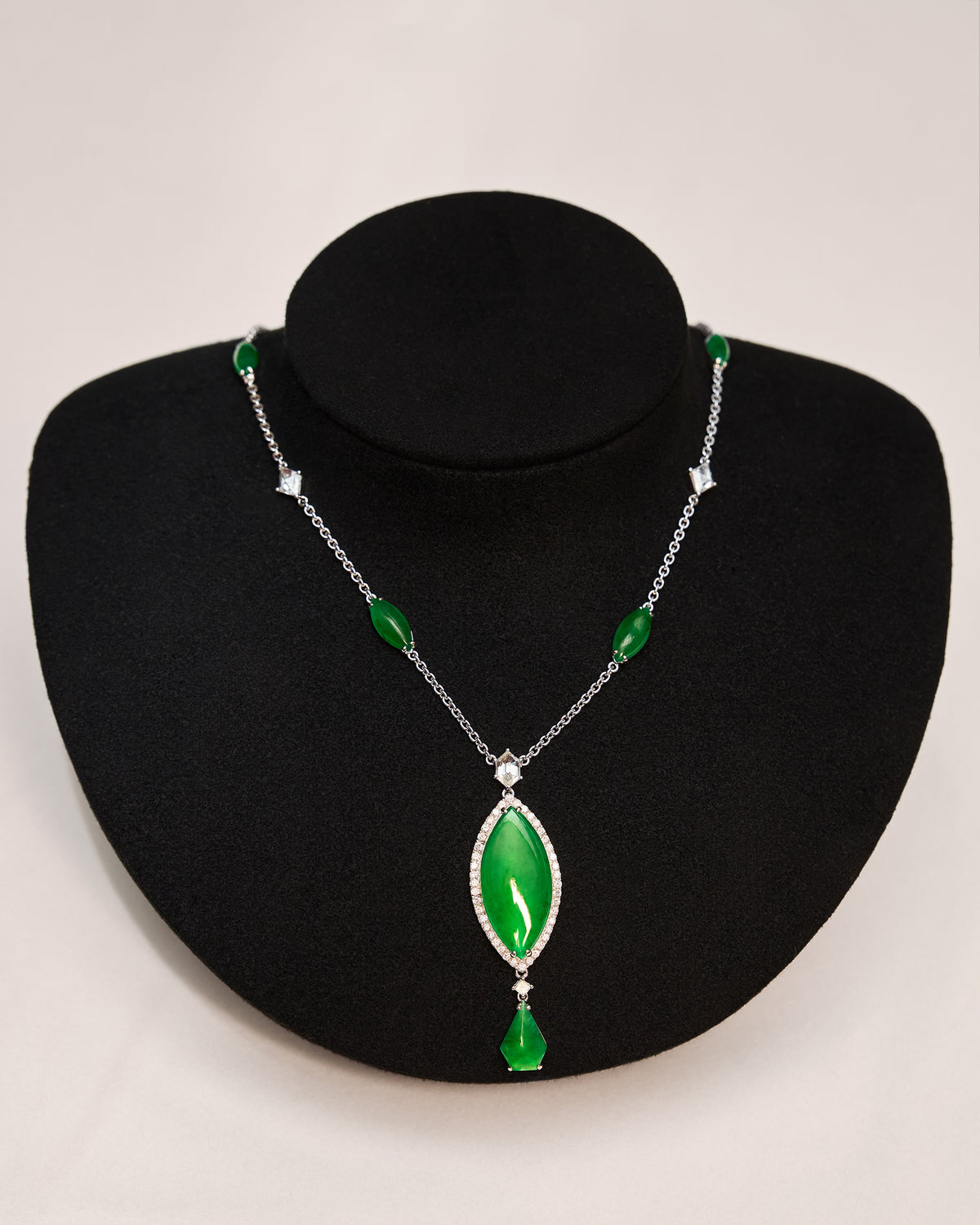 Close front view of The Marquise Cascade Necklace on a black neck bust, showing the precise rhythm of alternating marquise-shaped cabochons and rose-cut diamonds along the chain.