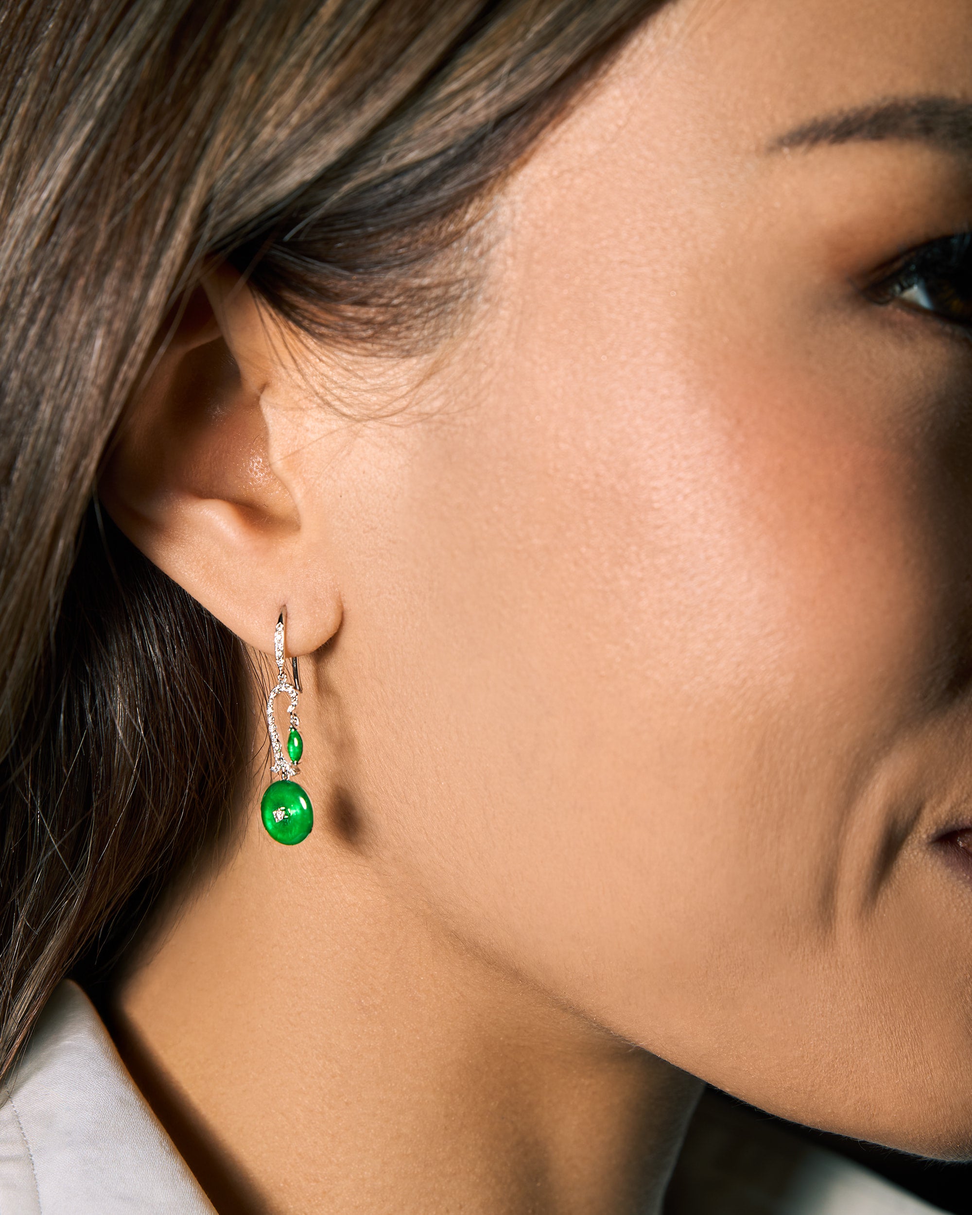 The Arc & Marquise Drop Earrings worn on a model, highlighting the 30 mm drop length and movement along the jawline.