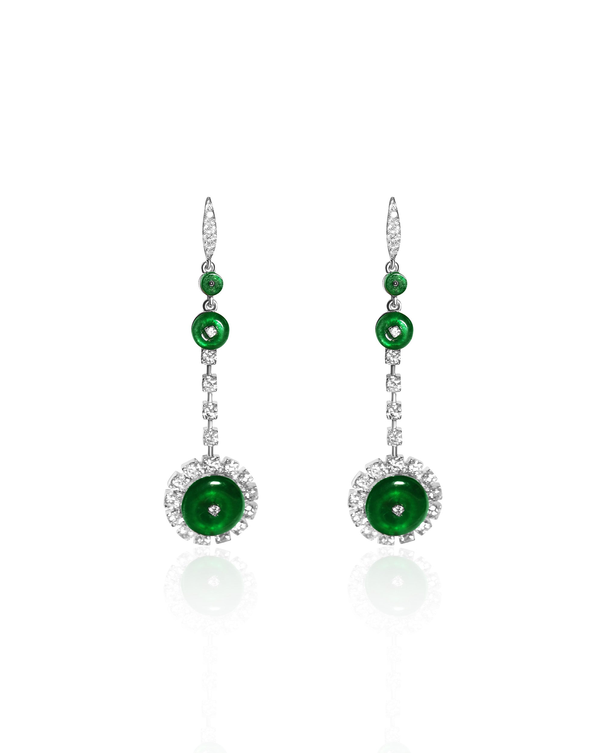 Bright green jadeite drop earrings featuring three graduated discs with a diamond-set finale, highlighting scale progression, set against a white background, front view.