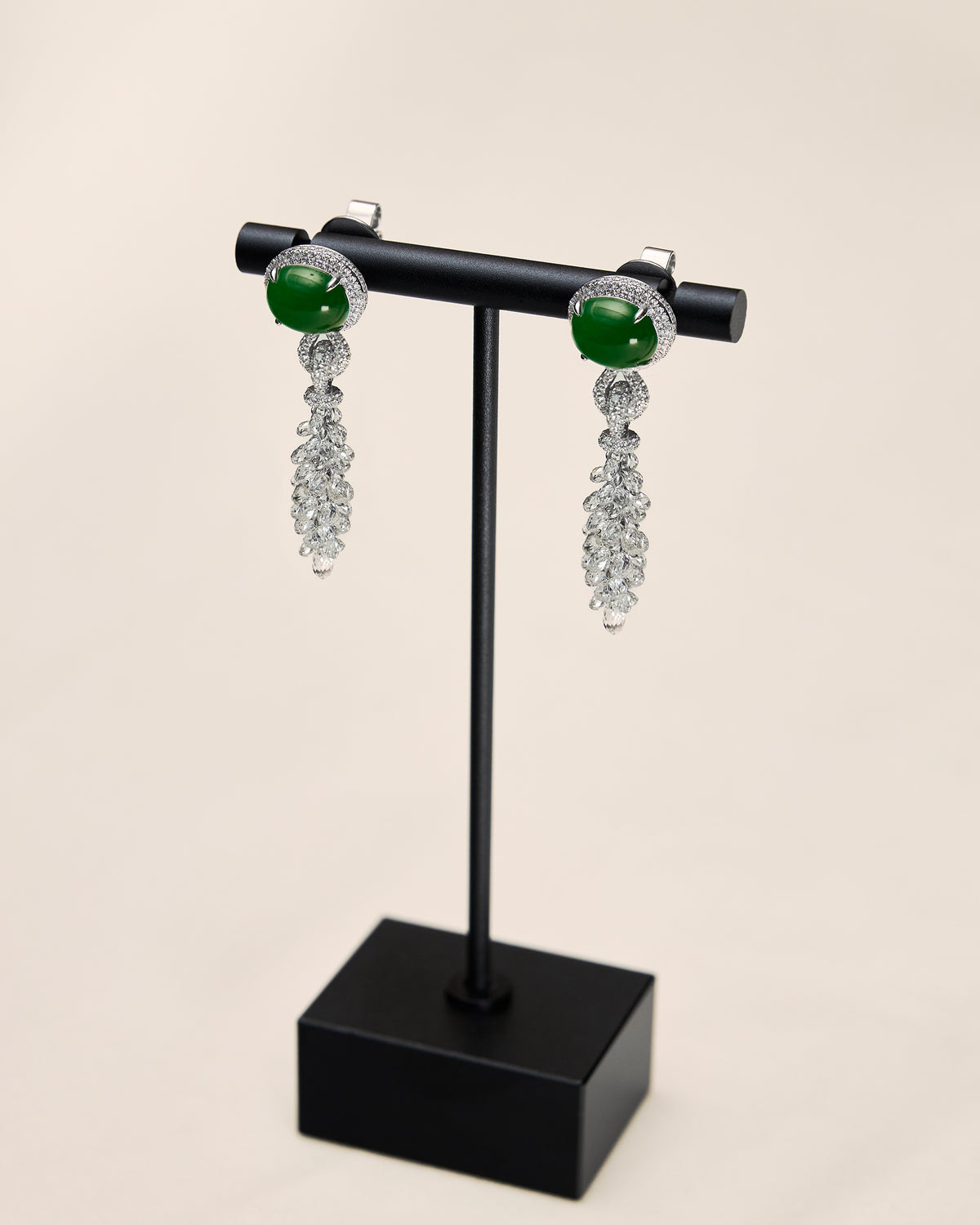 Side profile of The East-West Oval Cabochon Drop Earrings highlighting the double-convex depth of the cabochon and the layered kinetic movement of the briolette drop.