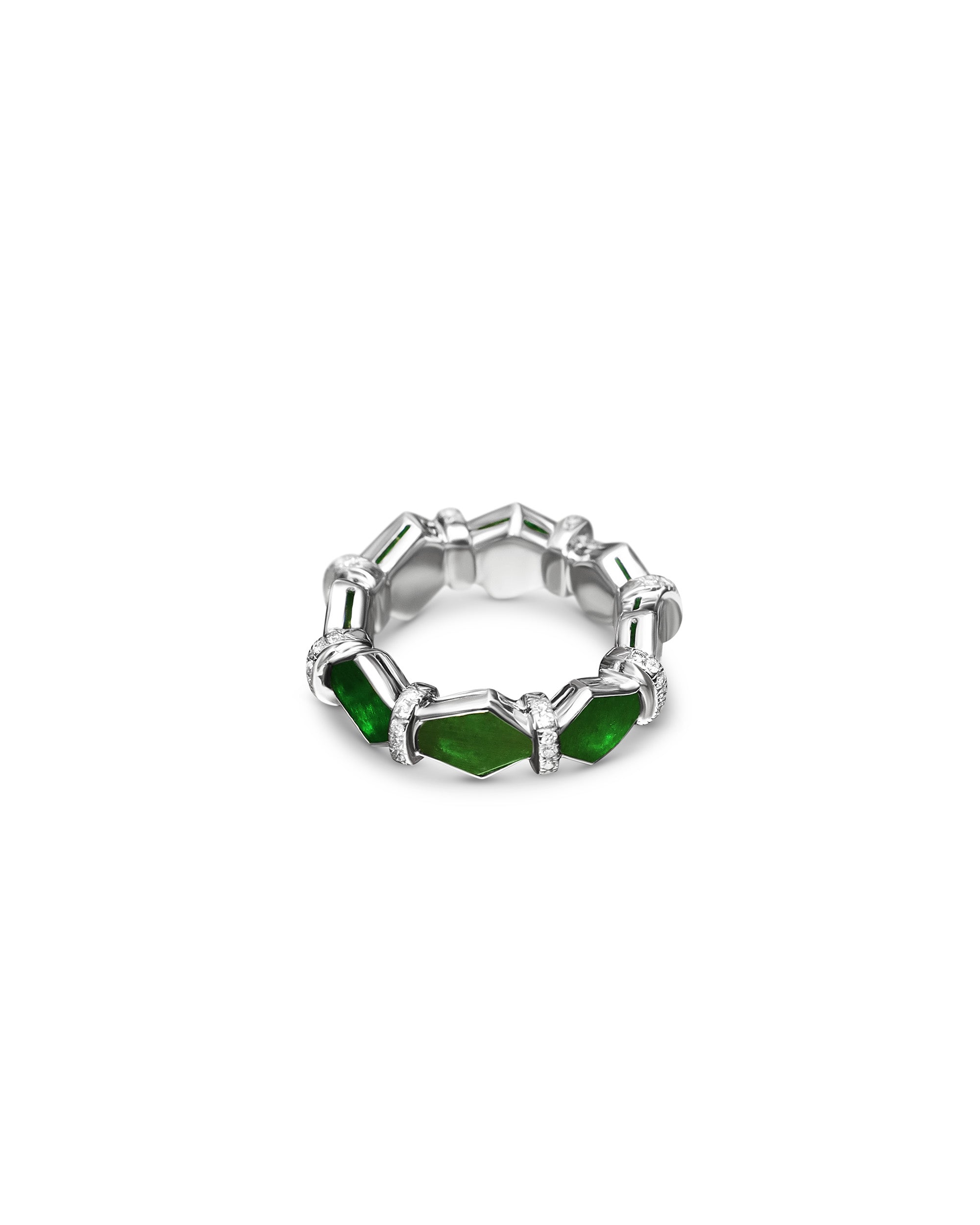 Bright green irregular hexagon jadeite eternity ring separated by minimal diamond rondelles on a white background, front view.