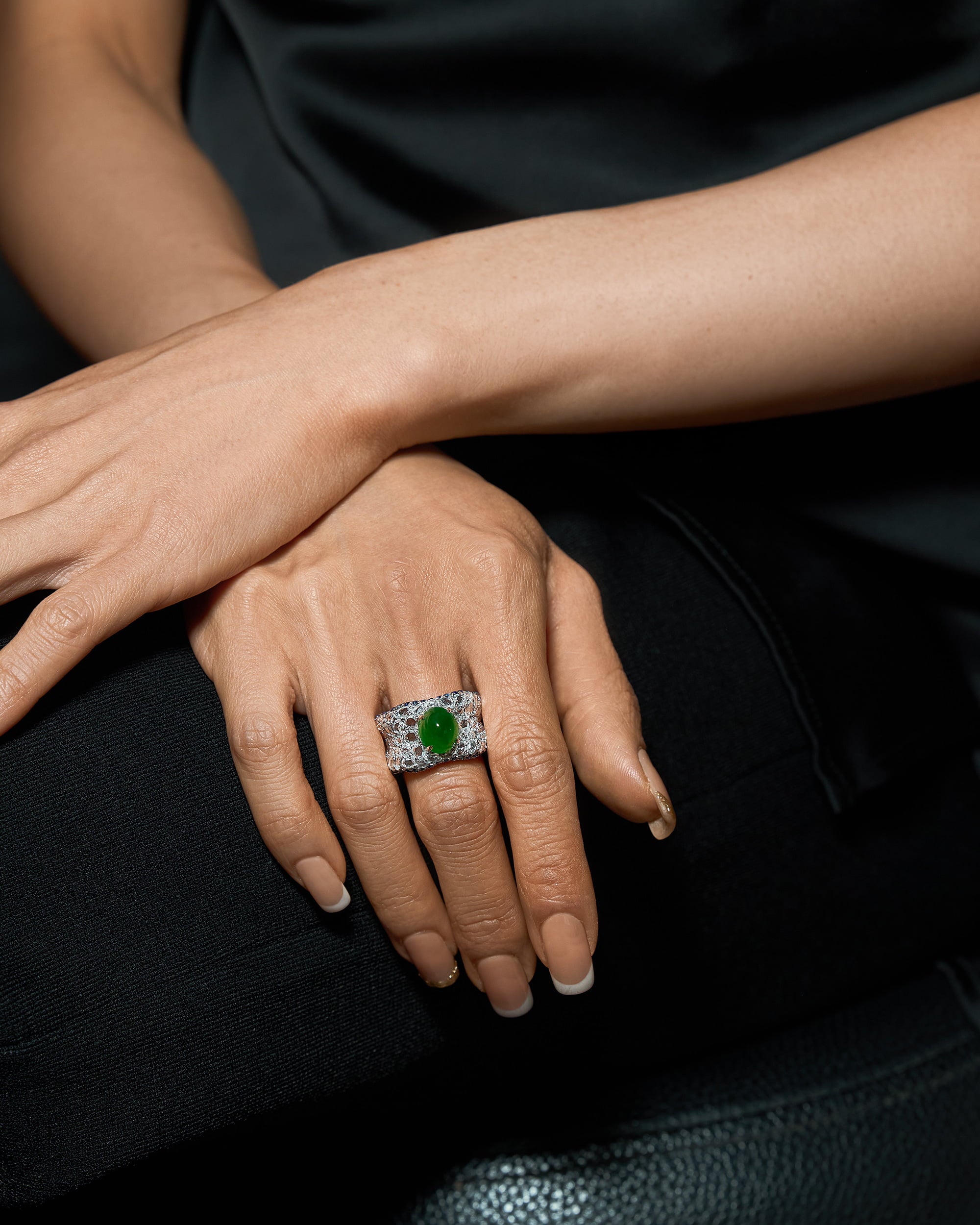 The Oval Mosaic Ring worn on a hand, showcasing the bold architectural presence and the continuous shimmer of the rose-cut diamond band.